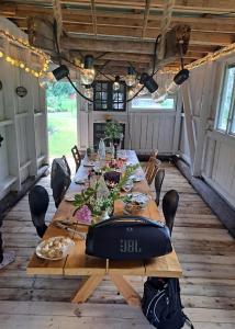 a dining table in an rv with food on it at Chilla villa in Leryd +20 photos