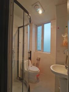 a bathroom with a toilet and a sink at Times International in Beijing +30 photos