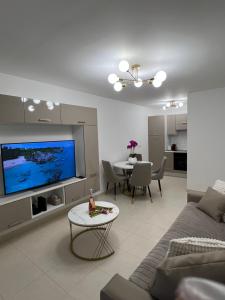 a living room with a couch and a table at One minute to the Beach in Menton