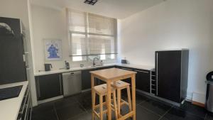 a kitchen with a small table and a sink at test in Saint-Avertin +11 photos