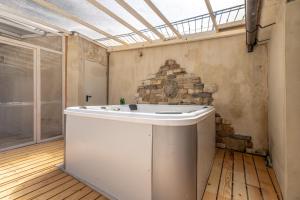 a bathroom with a sink in a room with a window at Villa Morotti by Mmega in Montone +37 photos