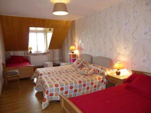 a bedroom with two beds and a living room at La prée in Seligny +14 photos