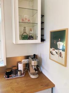 a kitchen counter with a coffee maker on it at Romantic Old Town Hideaway in Haapsalu