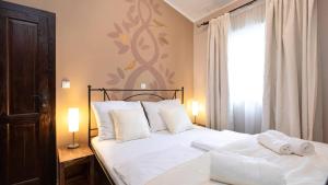 a bedroom with a bed with two towels on it at Appartment house Zara in Brzac +78 photos