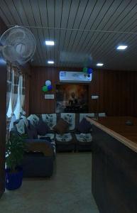 a living room with a couch and a bar at Hotelthemarwarexcellency in Jodhpur
