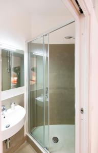 a glass shower in a bathroom with a sink at CasaCirio Agriturismo in Rialto