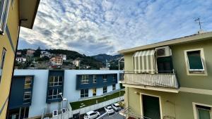 a view of a city from the balcony of a building at Garage Privato Elegante Bilocale in Alassio