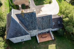 an overhead view of a large building with black roof at Le Grand Mesnil - Collection Idylliq in Pré-en-Pail