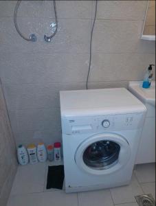a washing machine in the corner of a bathroom at Podgorica apartment in Podgorica +6 photos