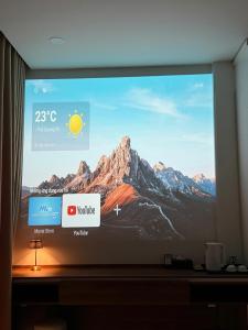 a television screen with a picture of a mountain at 19 home in Hue