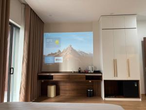 a bedroom with a projection of a mountain on the wall at 19 home in Hue
