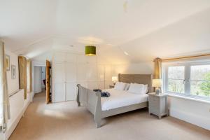 a bedroom with a white bed and a window at 6 Bed in Docklow oc-d31042 in Docklow