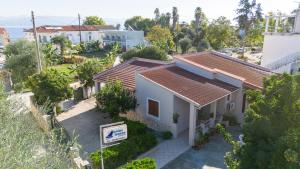 an aerial view of a white house with red roof at Ionian Breeze Apartments in Kavos