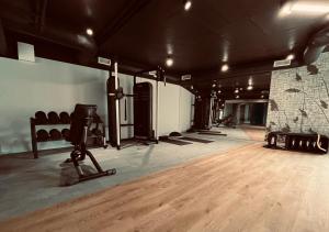 a gym with a camera and a wooden floor at Apartamenty prywatne przy Samej Wodzie w Riva Zegrze - Jezioro Zegrzyńskie in Zegrze Południowe
