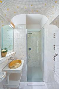 a bathroom with a shower and a toilet and a sink at Hotel Firenze in Venice +46 photos