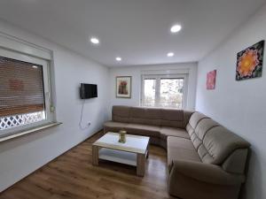a living room with a couch and a table at Ferienhaus Werratalsee in Frieda