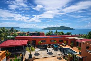a view of the ocean from the balcony of a building at Le Passamainty Lodge in Mamoudzou