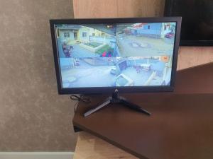 a flat screen tv sitting on top of a table at dlb VILLA 2 in Baku