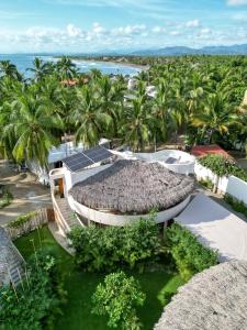 an aerial view of a resort with palm trees at Villas Cononda in La Majahua