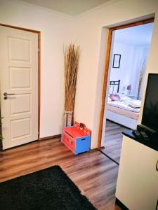 a room with a door and a room with a bed at No°21 Apartman in Szilvásvárad