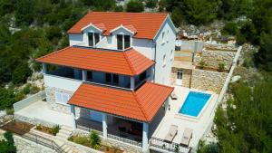 an aerial view of a house with an orange roof at Villa Julija by Villas Guide in Smokvica