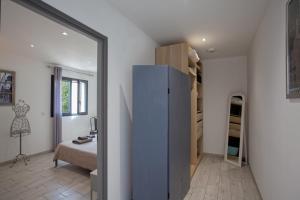 a small room with a closet and a bedroom at Casa Bianca in LʼÎle-Rousse +17 photos