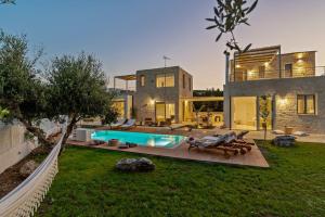 a house with a swimming pool in the yard at Annassa Experience Villa 2' walk from Almyrida beach in Almyrida
