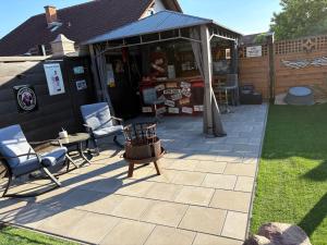 a patio with two chairs and a gazebo at Rodenbach 1 BR Apartment in Rodenbach
