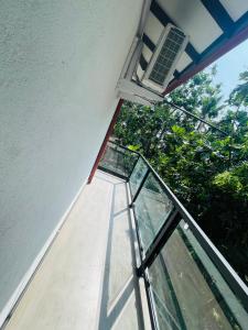 a stairway leading up to a building with a window at Woori House in Kamburugamuwa