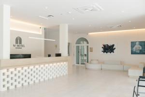 a lobby of a salon with a waiting room at M Hotel Kanchanaburi in Ban Chuk Kum