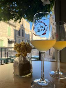 two glasses of wine sitting on a table at Chez Marie & Nico in Aigues-Mortes