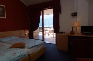 Katil atau katil-katil dalam bilik di Hotel Alpi
