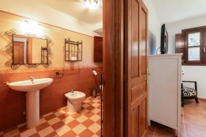 a bathroom with a sink and a toilet at Casa cerca Playa Cuevas del Mar Llanes - River in Llanes +40 photos