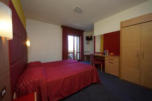 Katil atau katil-katil dalam bilik di Hotel Alpi