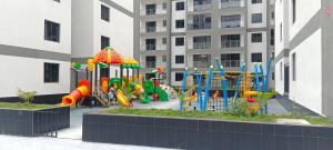 a playground in front of a apartment building at Elite Homes furnished Studio near JKIA in Syokimau