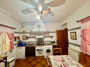 a kitchen with a ceiling fan and a dishwasher at Los Jabones in Ciudad Real +9 photos