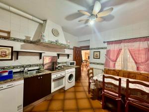 a kitchen with a sink and a stove at Los Jabones in Ciudad Real