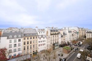 an aerial view of a city with buildings at Loft Duplex Terrasse View on Paris in Paris +15 photos
