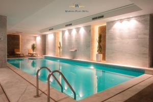 a large swimming pool in a hotel room at Marhaba Plaza Hotel in Tripoli