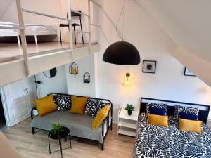 a living room with a couch and a bunk bed at Sint-Jans Appartments in Antwerp