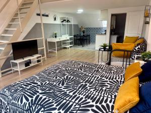 a living room with a bed and a staircase at Sint-Jans Appartments in Antwerp