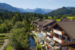 an aerial view of a resort with a river at Parkhotel Burgmühle in Fischen