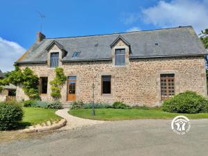 a large brick house with a gravel driveway at La grande reignière in Brécé +42 photos