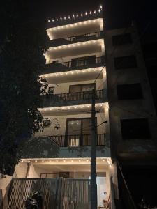 a building with lights on the side of it at Chèrie Blueleaf in Jaipur