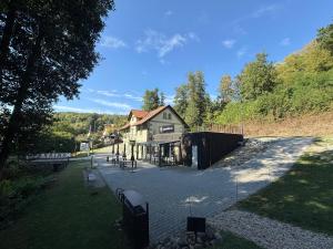 a building with a fence in front of it at Mulino Apartments in Borek