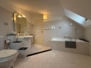 a bathroom with a toilet and a sink and a tub at Terra D'Amuri in Barrafranca +47 photos
