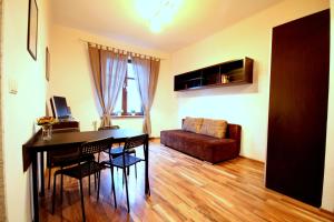 TV a/nebo společenská místnost v ubytování Apartament Premium