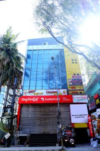 a building with a sign on the side of it at Sri Sai comforts - Bannerghatta Main Road in Bangalore