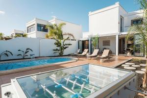 an image of a house with a swimming pool at Villa Zendaya in Yaiza