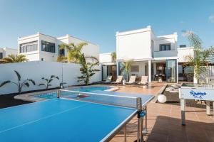 a villa with a pool and a tennis court at Villa Zendaya in Yaiza